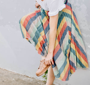 Powerful modestly dress women in a zig zag print skirt